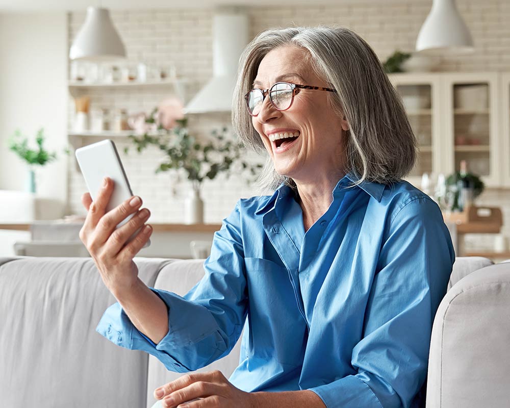 woman using a phone for online therapy