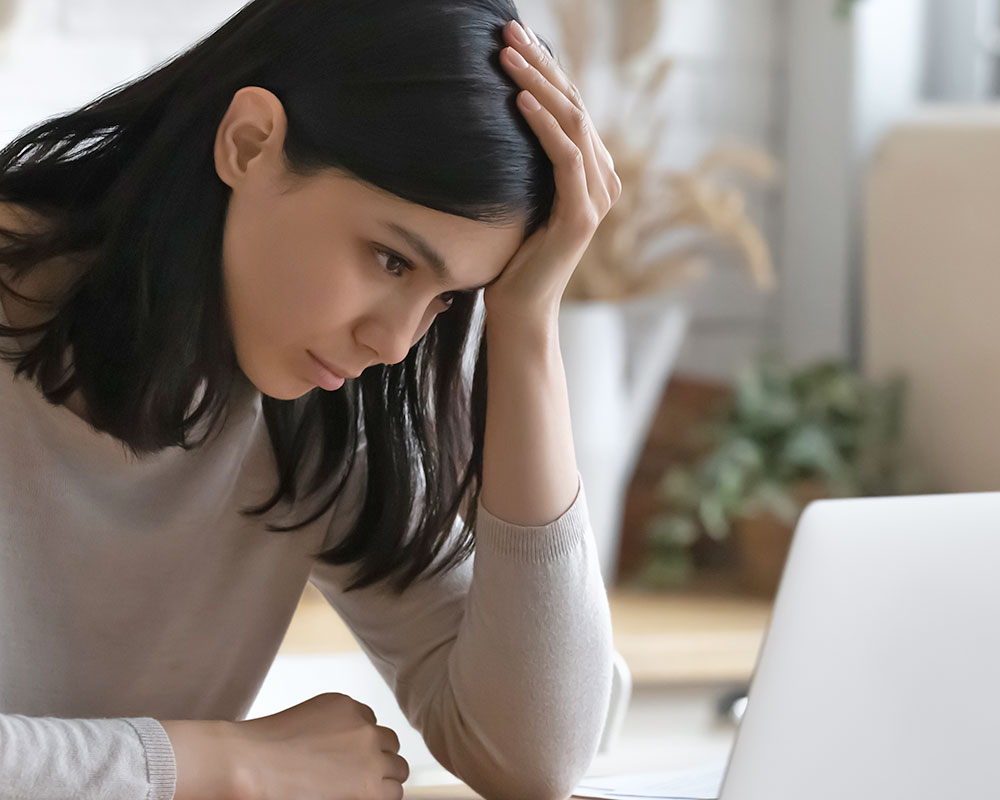 woman using a laptop for online counseling